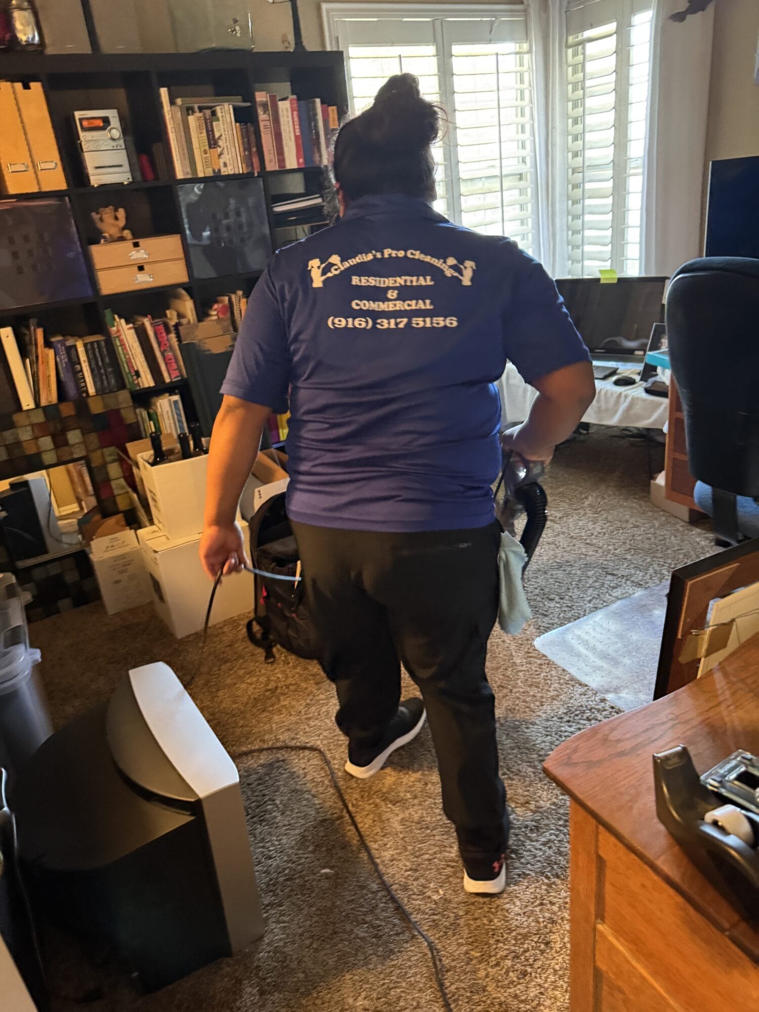 Professional recurring cleaning technician cleaning a residential kitchen in Arden Arcade, CA