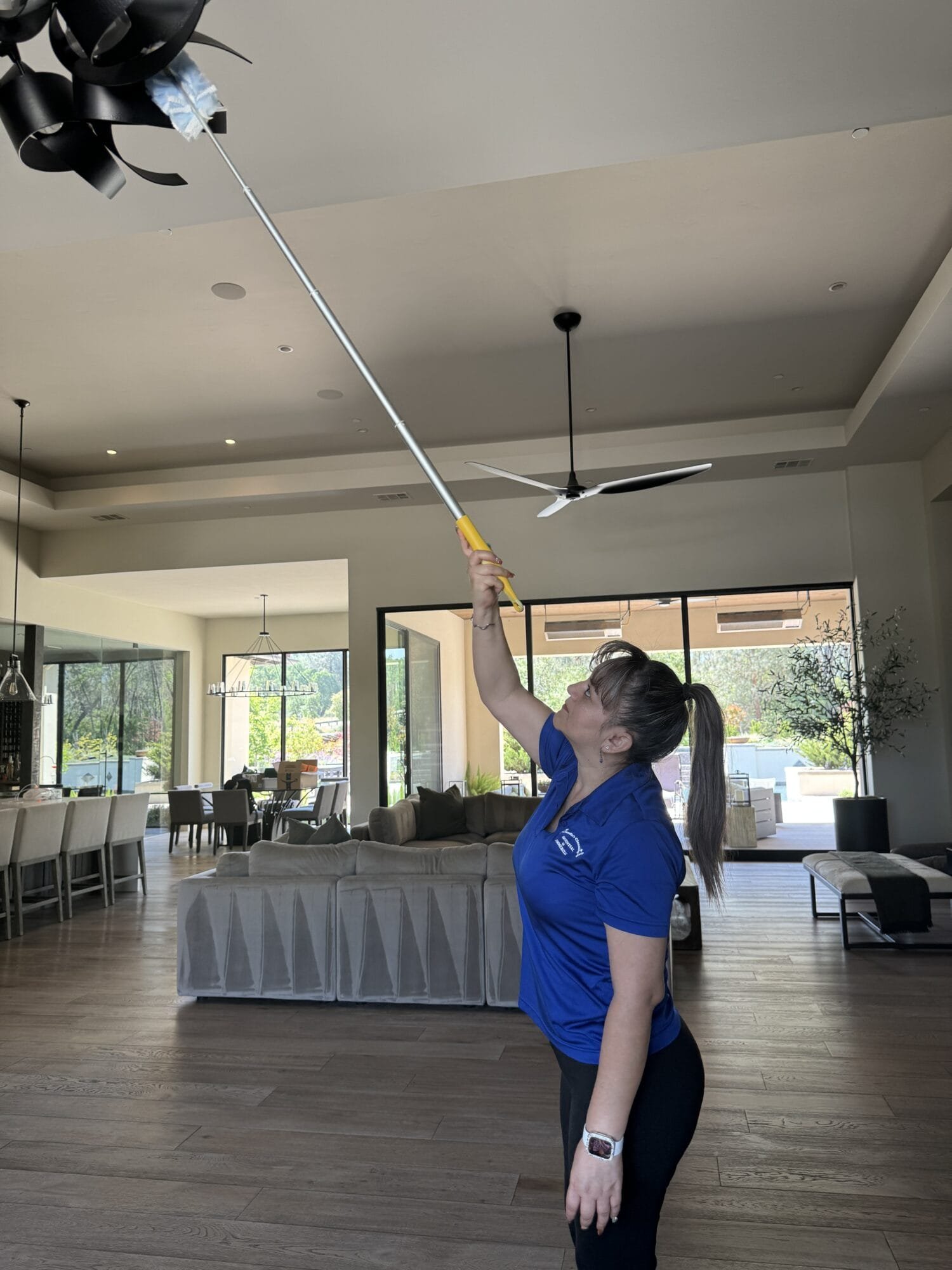 Professional cleaner mopping floors during a deep cleaning service in Empire Ranch, Folsom, CA