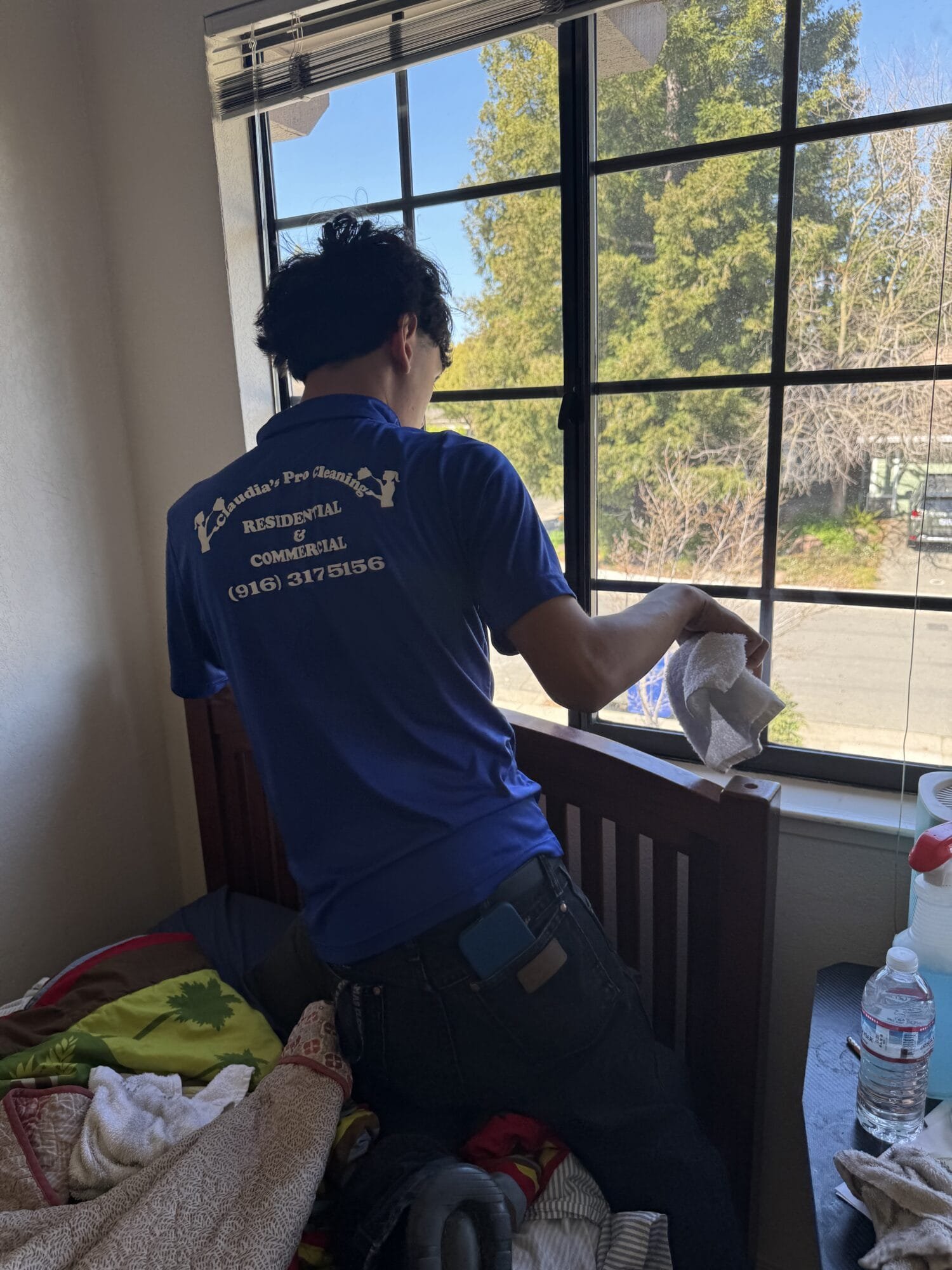 Professional post-construction cleaning team cleaning windows after a home renovation in Brookside, Stockton, CA.
