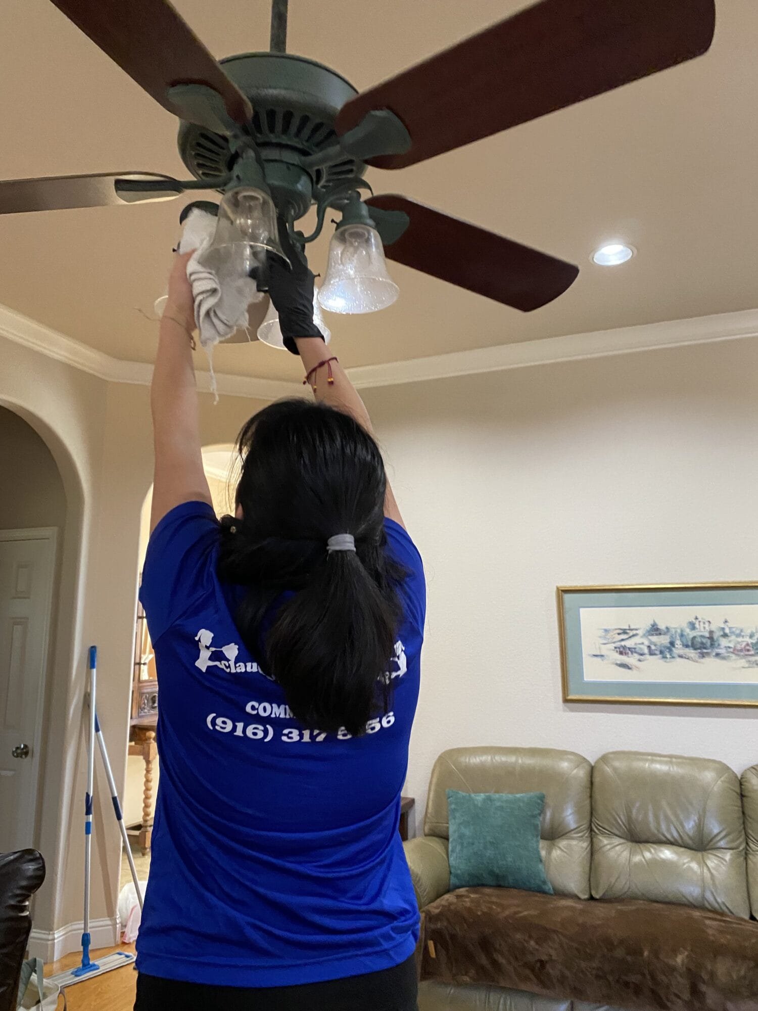 Cleaning technician dusting a ceiling fan during a deep cleaning service in Lincoln Village West, Stockton, CA