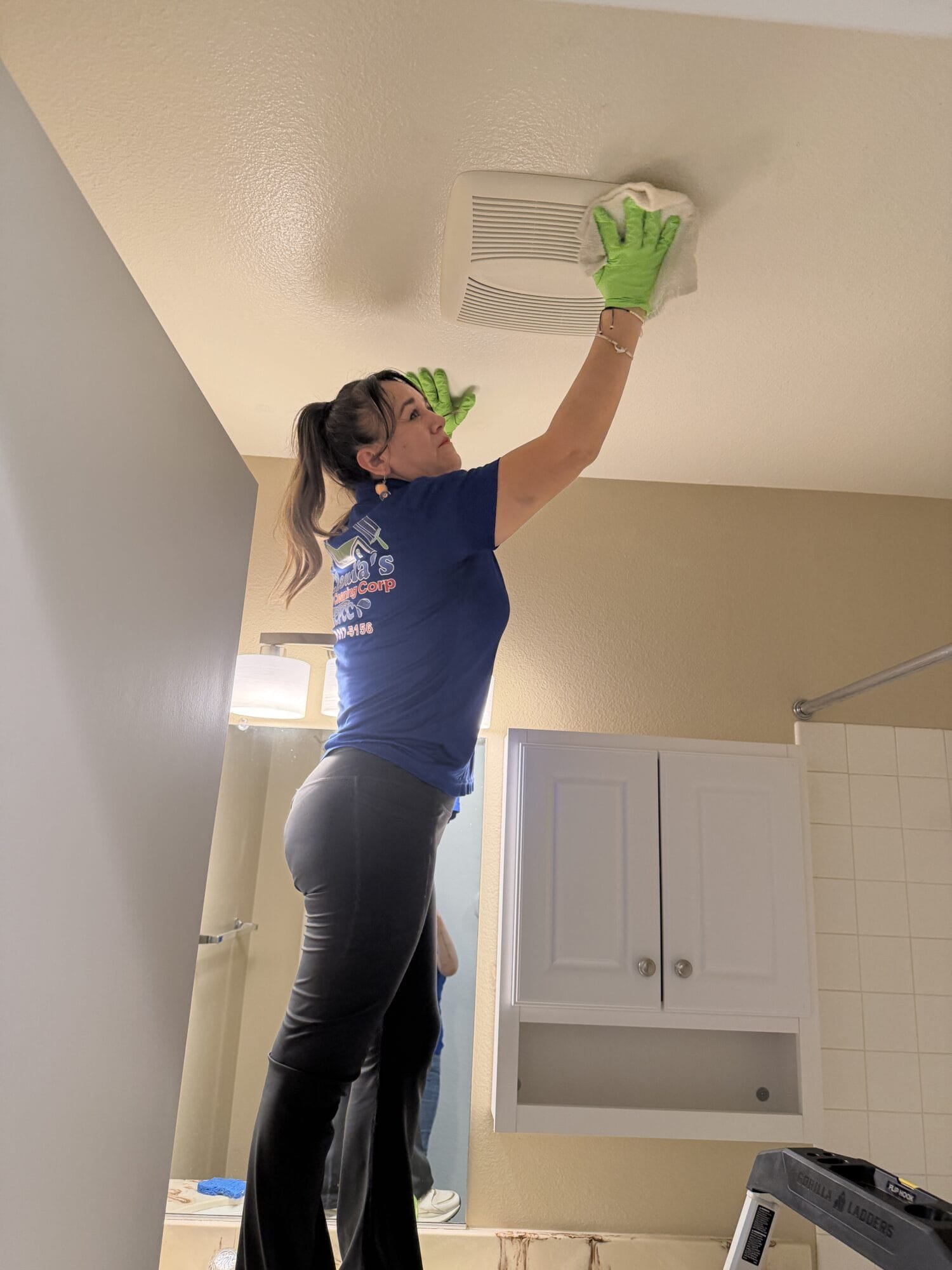 Professional maid cleaning floors in a Davis, CA home