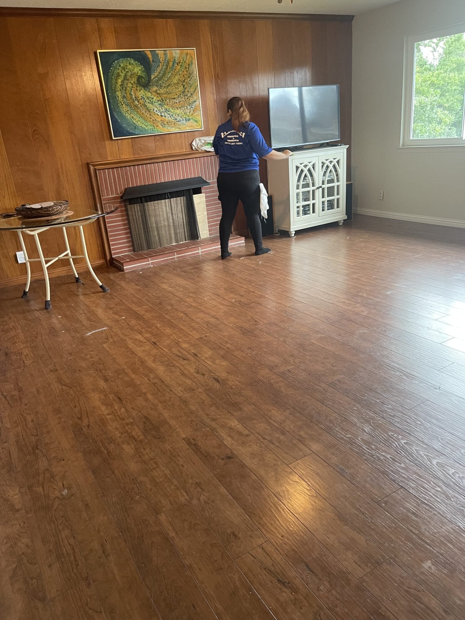 Post construction cleaning technician removing dust from walls during a final cleaning service in Mission Oaks, CA.