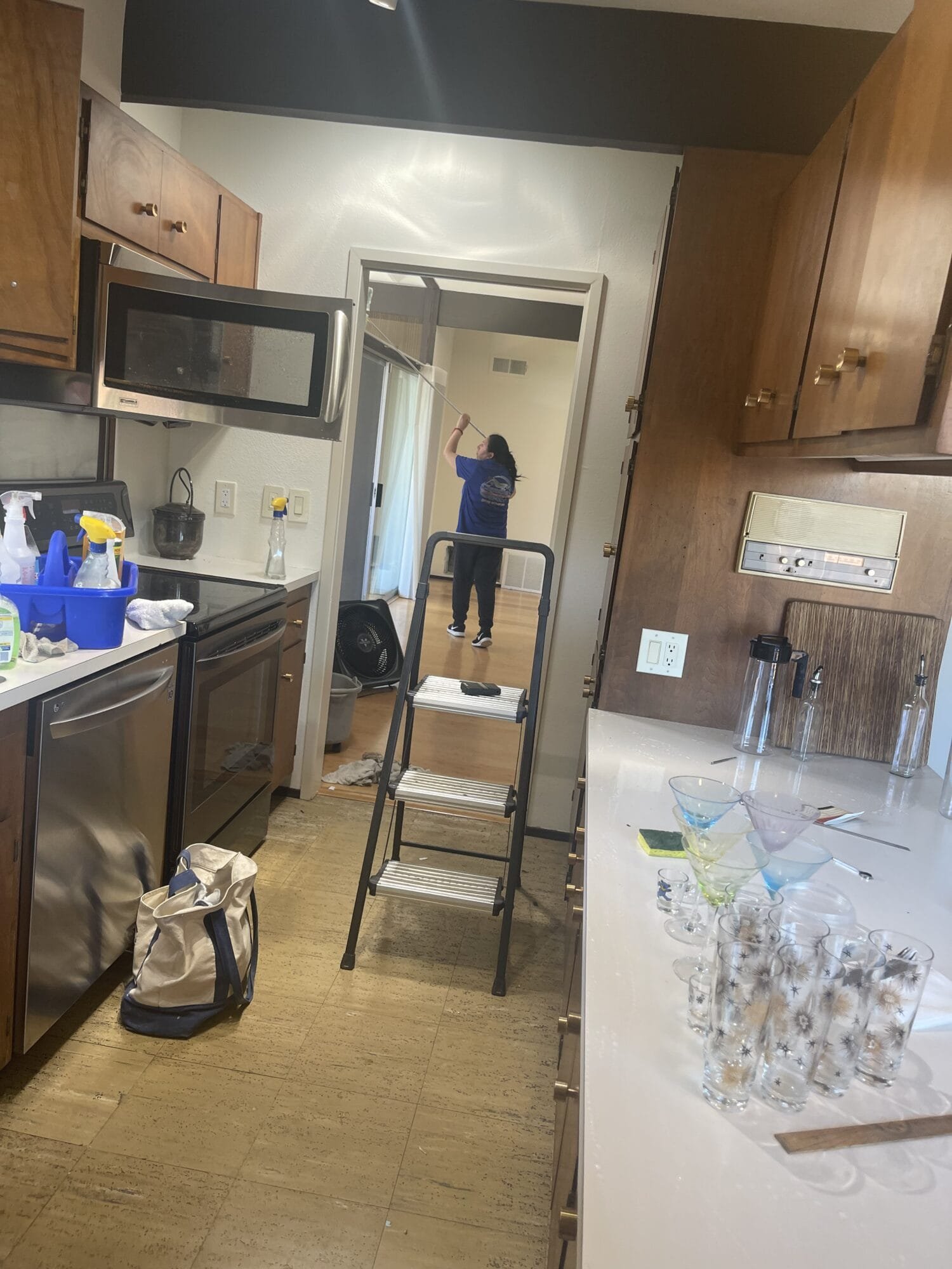 Professional maid cleaning floors in a Davis, CA home