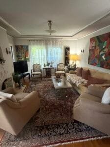Clean living room with seating and warm lighting